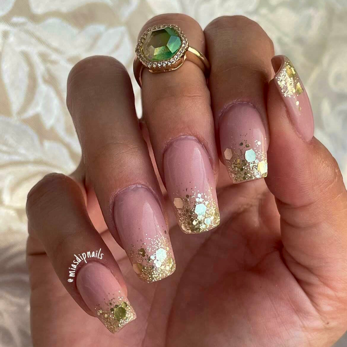 Long squared nails with silver chunky glitter dip powder on clear tips over natural pink base.