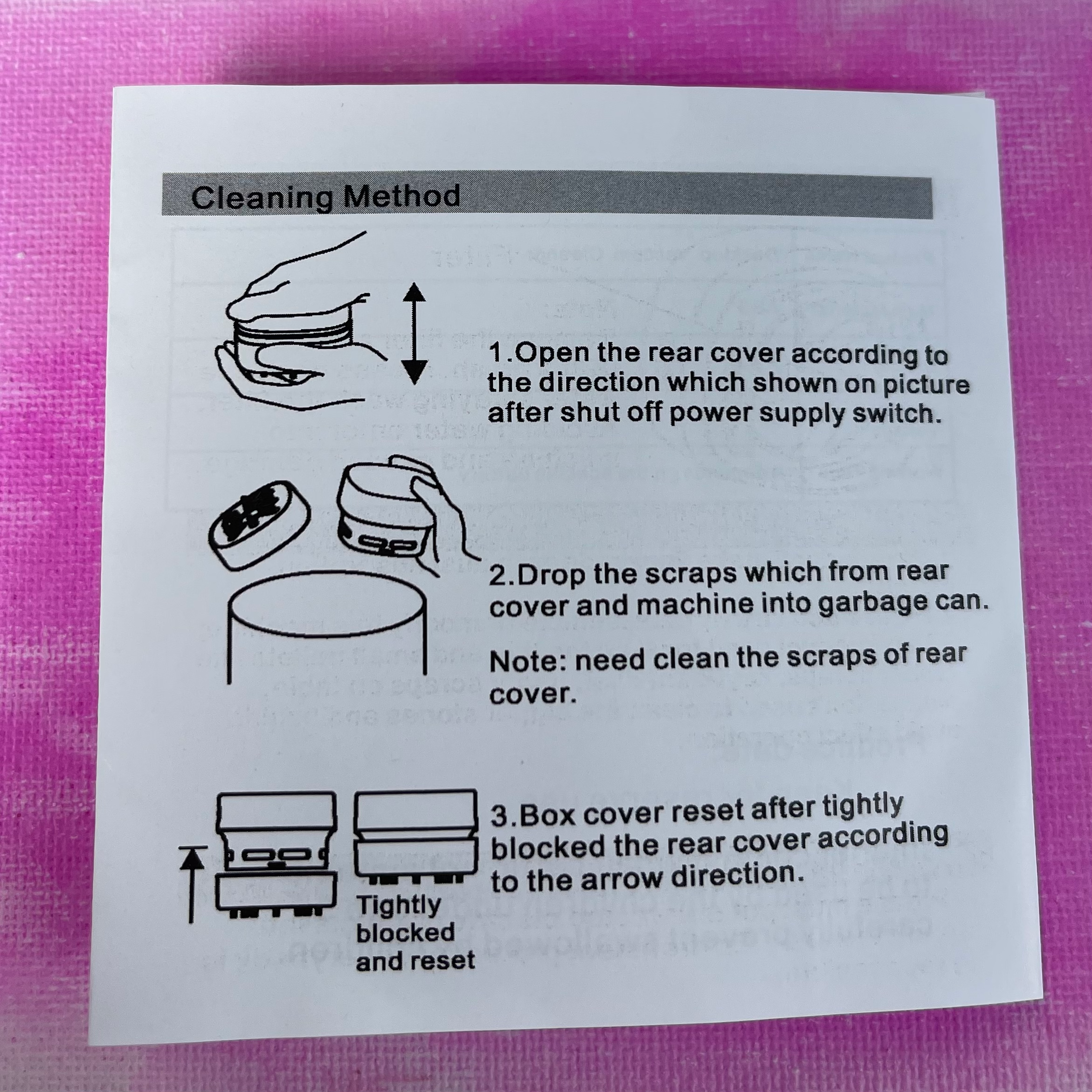 Instruction sheet showing steps to open, clean, and reset a mini desk vacuum's rear cover with simple line drawings on white .