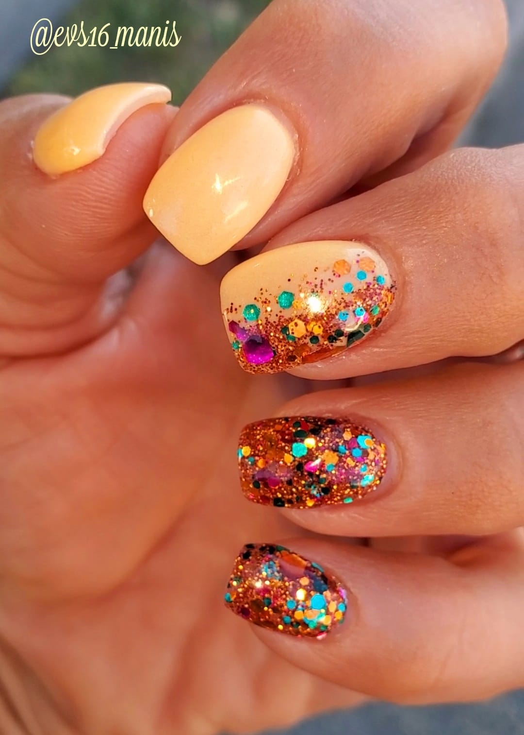 Yellow solid dip powder nail polish with glittery multicolor sparkle accent nails.