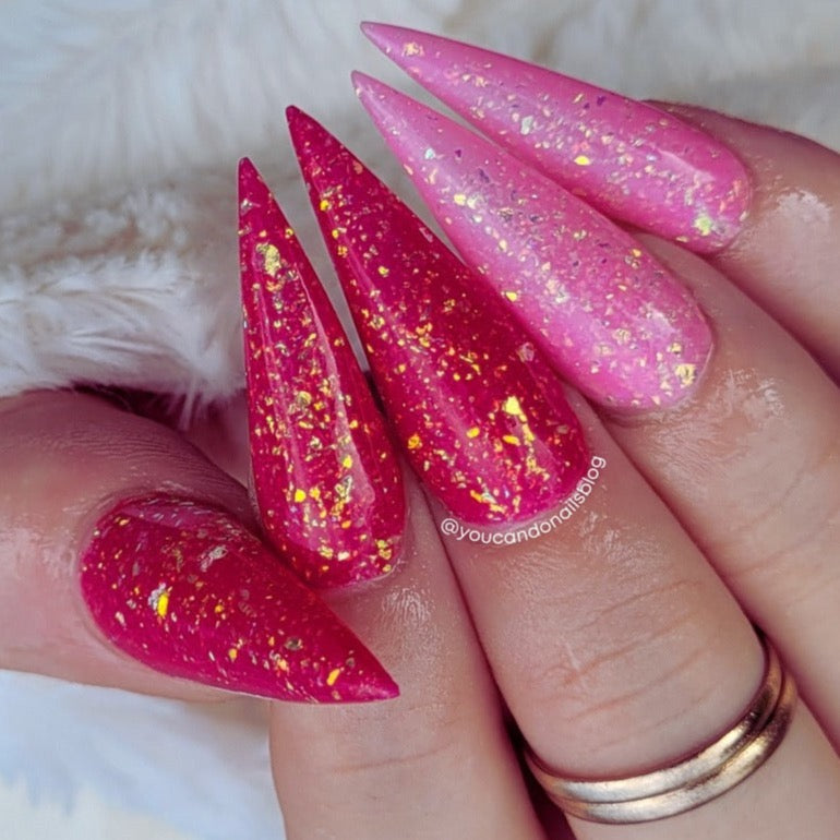 Long stiletto nails with pink and deep rose chameleon flake glitter dip powder polish.