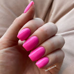 Bright hot pink polished nails with a smooth, glossy finish on medium square tips.