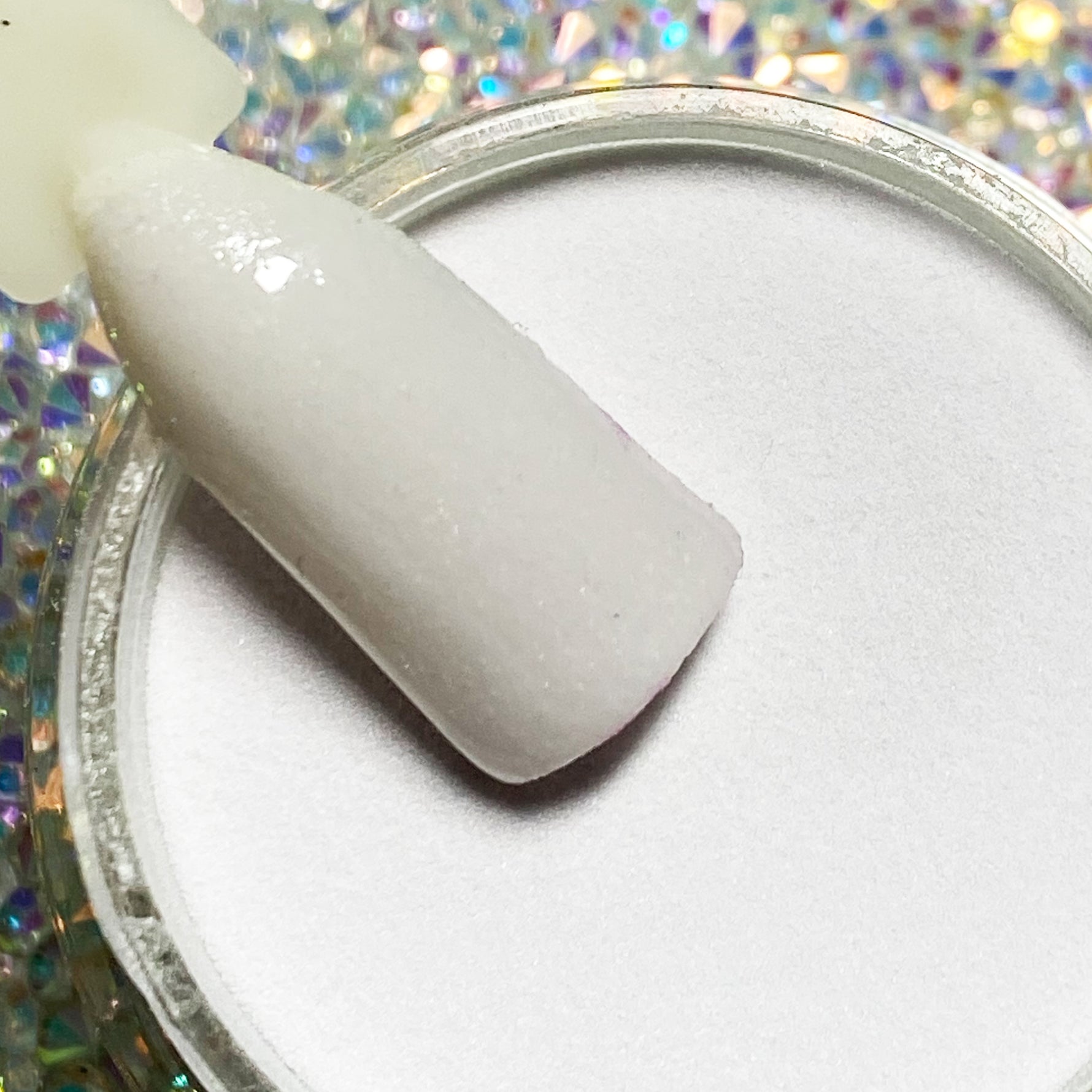 White nude dip powder nail color swatch with smooth, glossy finish.