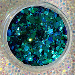 Blue and green chunky glitter mix with iridescent sparkle in clear container.