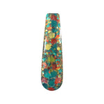 Nail swatch with multicolor chunky glitter in blue, orange, yellow, and green on clear base.