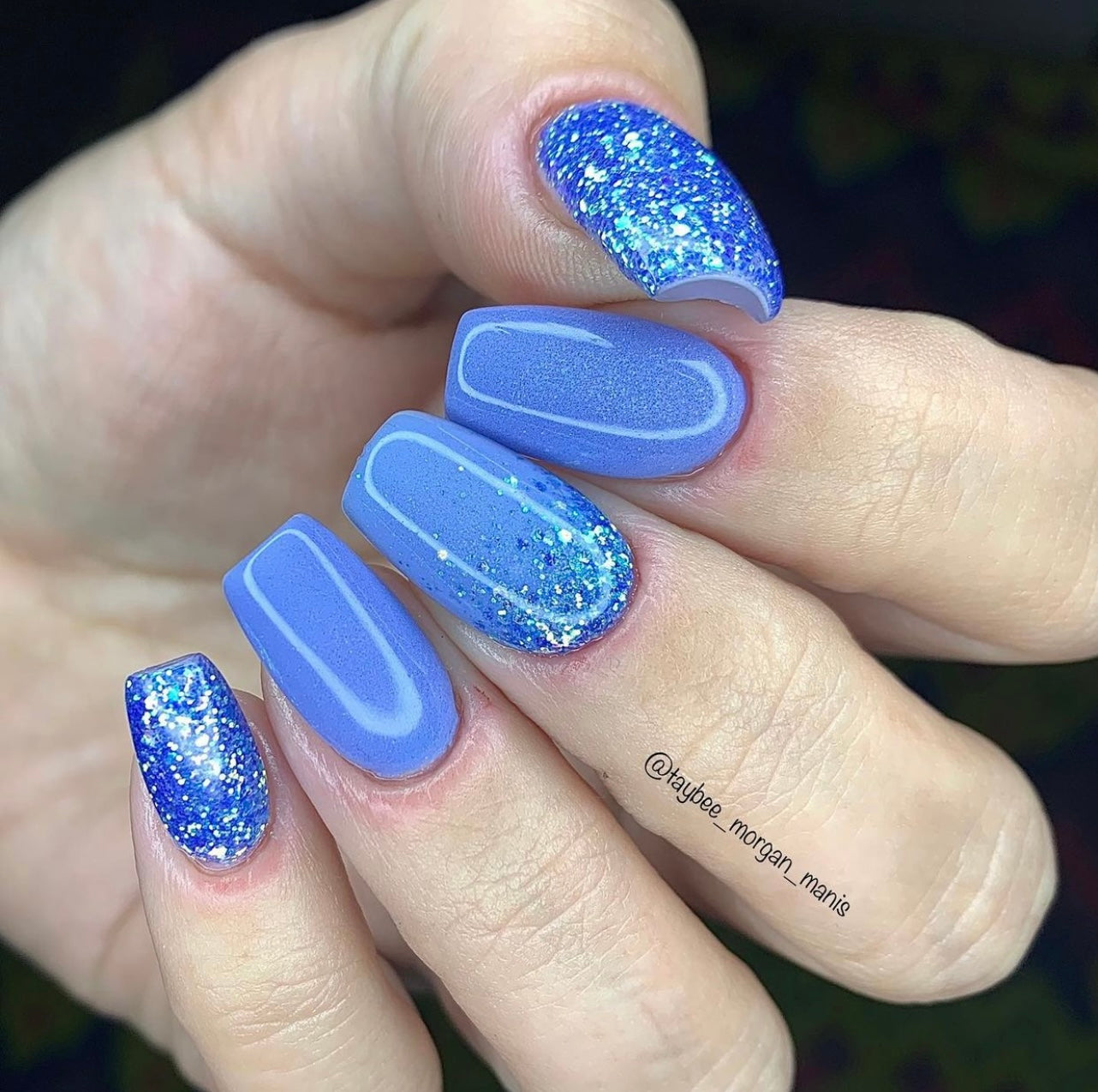 Blue chunky glitter and holographic dip powder nails with glossy finish on medium-length square tips.